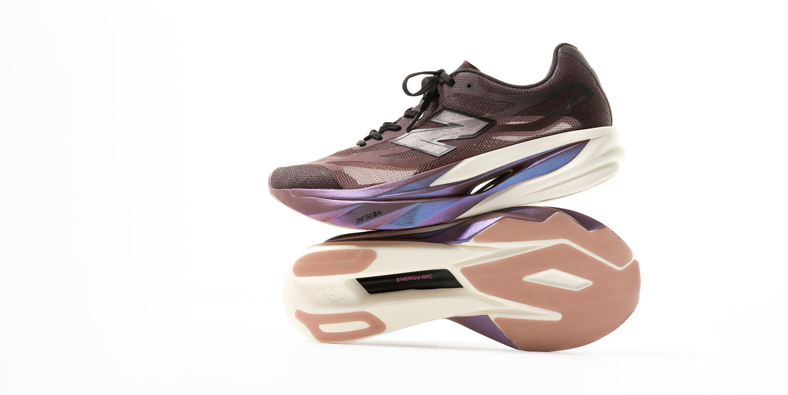 Running shoe in purple and cream colorway displayed in a studio product shot showing both the side profile and outsole.